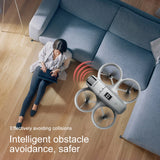 D16 drone flying indoors near a sofa with obstacle avoidance sensors