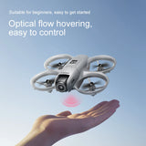 D16 mini drone hovering above an open hand using optical flow positioning