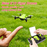 K10 mini drone flying outdoors controlled with a phone on the remote
